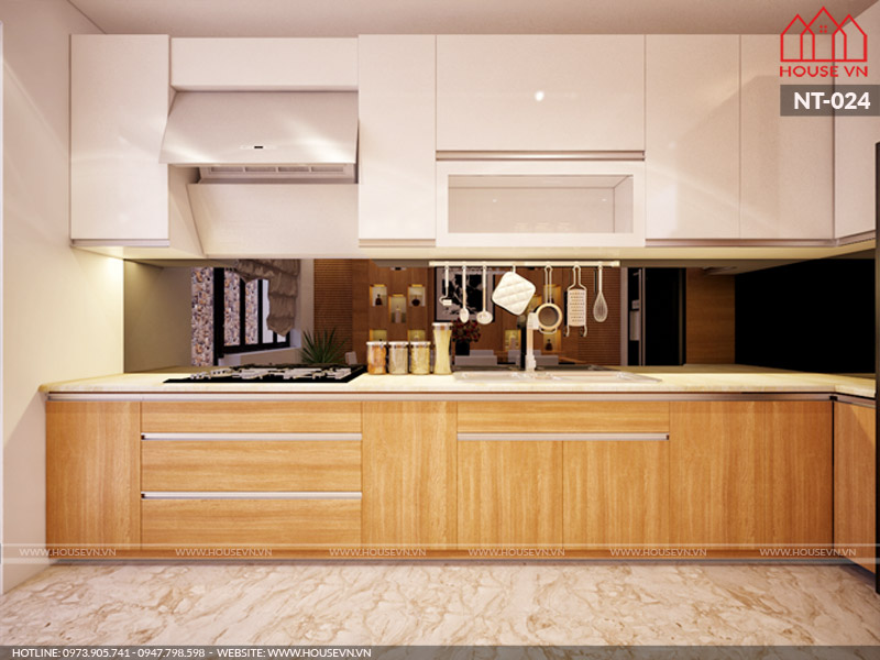 Không gian bếp nấu với thiết kế nội thất tủ bếp chữ L chất liệu gỗ công nghiệp cao cấp tiện dụng đảm bảo nhu cầu sử dụng và sinh hoạt nấu nướng lý tưởng nhất cho gia chủ